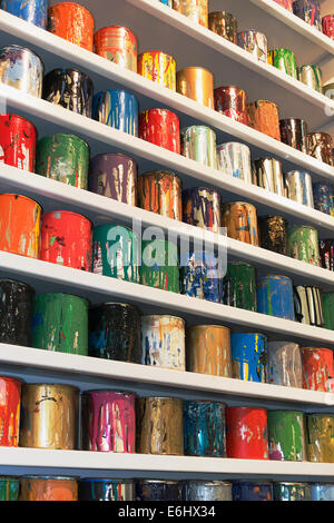 shelves with cans of silk screening paints Stock Photo