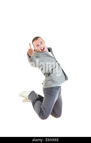 Man in suit laughing and jumping up, Enjoying in his success with thumb up Stock Photo