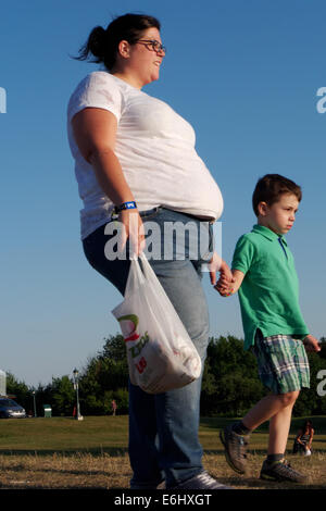 An obese woman with a young child Stock Photo