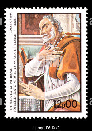 Postage stamp from Guinea-Bissau depicting detail from the Sandro Botticelli painting 'St. Augustine in the Work Hall' Stock Photo