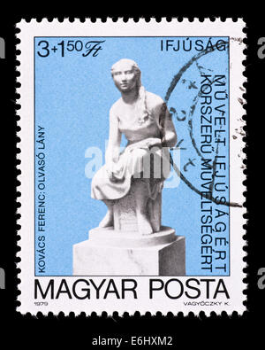 Postage stamp from Hungary depicting the Ferenc Kovacs sculpture 'Girl reading a book'. Stock Photo