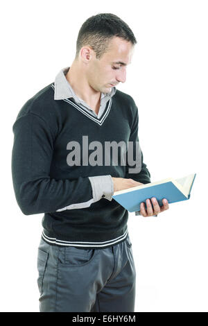 Handsome athletic man reading book dressed elegant and seriously studying Stock Photo