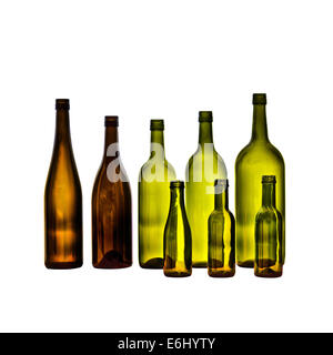 Empty glass wine bottles on white background. Bottles in various shapes and sizes. Stock Photo