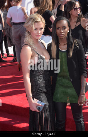 Inglewood, California, USA. 24th Aug, 2014. US model Ireland Baldwin (L) and US singer Angel Haze arrive on the red carpet for the 31st MTV Video Music Awards at The Forum in Inglewood, California, USA, 24 August 2014. Photo: Hubert Boesl/dpa/Alamy Live News Stock Photo