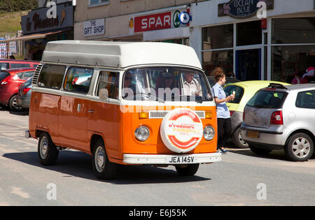 A classic VW campervan in Polzeath, Cornwall, England, U.K. Stock Photo