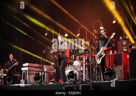 Leeds, UK. 23rd August, 2014. Josh Homme from Queens of the Stone Age performs on Day 2 of the Leeds Festival at Bramham Park on August 23, 2014 in Leeds, England. Credit:  Sam Kovak/Alamy Live News Stock Photo