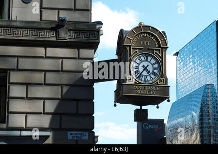 The clock of the Scottish Legal Life Assurance Society on Bothwell Street at Blythswood Street, Glasgow. Stock Photo