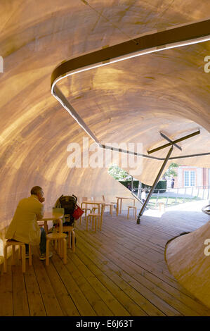 Serpentine Summer Pavilion 2014 outside The Serpentine Gallery in London designed by Smiljan Radic Interior View of Cafe Stock Photo