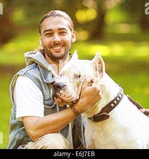 Man and Dog Argentino walk in the park. Stock Photo