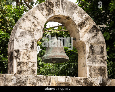 Antique wrought iron bell in mexican village of Playa del Carmen Stock Photo