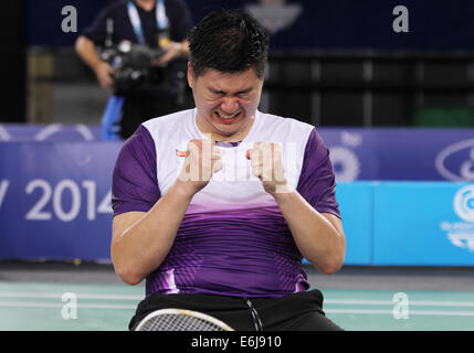 Chayut Triyachart of Singapore v England after winning the semi-finals of mens doubles in badminton at 2014 Commonwealth games Stock Photo