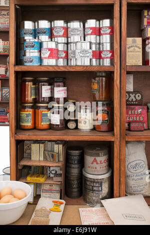 1940s replica grocers shop with packets of food and household items on the shelves at a historical military Reenactment show. UK Stock Photo