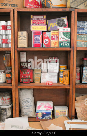 1940s replica grocers shop with packets of food and household items on the shelves at a historical military Reenactment show. UK Stock Photo