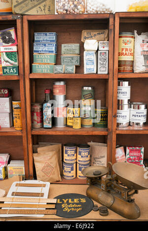 1940s replica grocers shop with packets of food and household items on the shelves at a historical military Reenactment show. UK Stock Photo