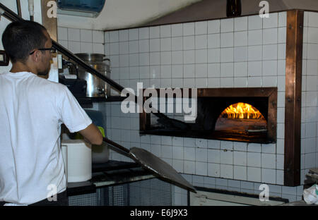 Thermometer with glowing embers in an outdoor wood-burning pizza oven for  cooking and baking Stock Photo - Alamy