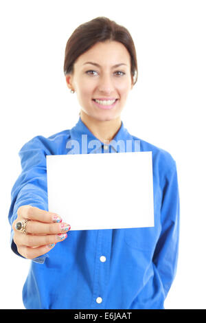 Image of smiling  pretty casual woman holding her large blank visiting card with one hand, copy space advertising Stock Photo