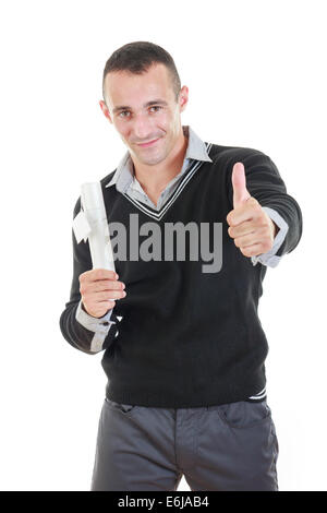 Successful student holding diploma on graduation day showing thumb up smiling Stock Photo