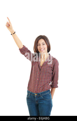young excited woman point finger showing something to up side empty copy space, standing happy smiling holding her hand, concept Stock Photo