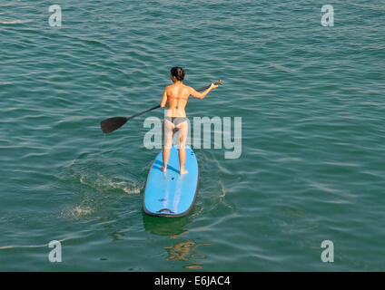 SUP, Paddle surf in the beach Stock Photo