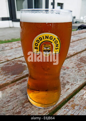 Glasses of Boddingtons Bitter from Manchester in a pint glass
