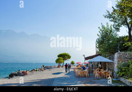 Lakefront cafe on the beach in Limone sul Garda, Lake Garda, Lombardy, Italy Stock Photo