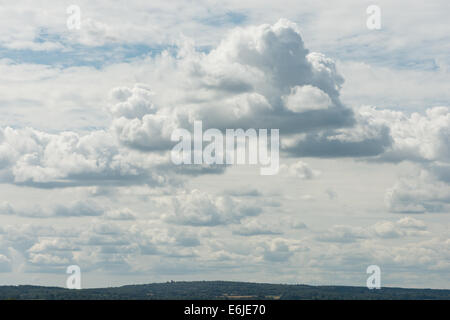 skyscape of dramatic puffy cotton wool clouds of layered cumulus stratocumulus developing into cumulonimbus higher altostratus Stock Photo