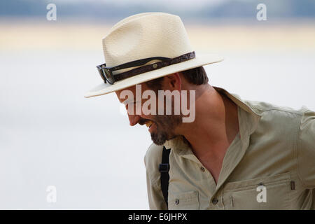 Bearded man in a panama hat smiling Stock Photo
