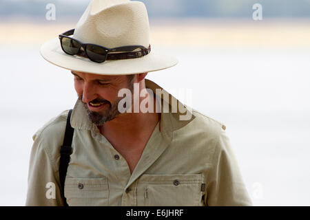 Bearded man in a panama hat smiling Stock Photo