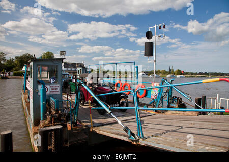 Old Austin drives off the Reedham Ferry on the River Yare in Norfolk. Stock Photo