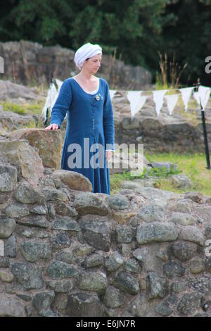 Woman in medieval dress on castle wall Stock Photo