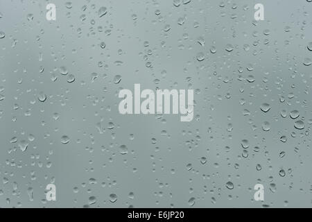 Trapped inside on a windy bleak rainy day in autumn winter spring summer overcast window raindrops view bleak weather forecast Stock Photo