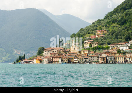 Lake Iseo Italy. Lago d'Iseo or Sebino with the village Peschiera Maraglio behind. Lombardy region. Northern Italy. Stock Photo