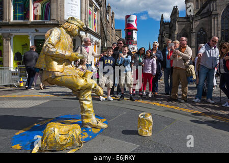 Street entertainer dressed as a statue in a sitting position without a support, during the Edinburgh Fringe Festival, Edinburgh, Stock Photo