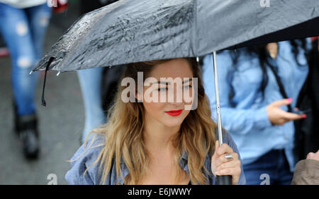 London, Britain. 25th Aug, 2014. A visitor is seen during the Notting Hill Carnival in London, Britain, on Aug. 25, 2014. Over 1 million visitors are expected to attend the two-day event which is the largest of its kind in Europe. The event has taken place on the West London streets every August Bank Holiday weekend since 1964. © Han Yan/Xinhua/Alamy Live News Stock Photo