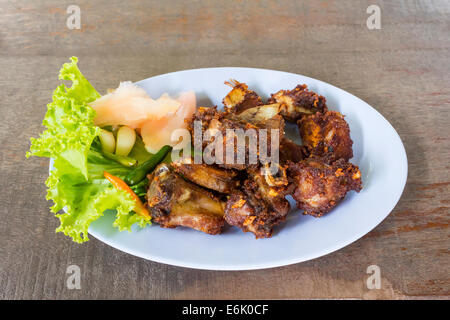 Deep fried sour pork fermented spare rib bone on dish Stock Photo