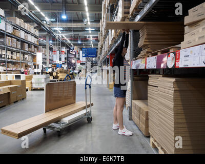 Customer picking up furniture at the Ikea store warehouse Stock Photo