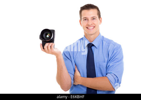 portrait of good looking male photographer holding camera Stock Photo