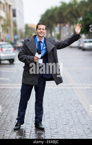 young journalist waiting for a cab Stock Photo