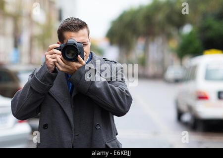 professional journalist taking photos outdoors Stock Photo