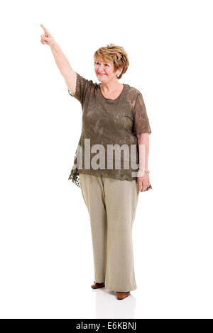 smiling senior woman pointing up isolated on white Stock Photo
