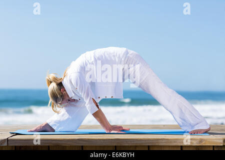 healthy mid age woman exercising outdoors Stock Photo