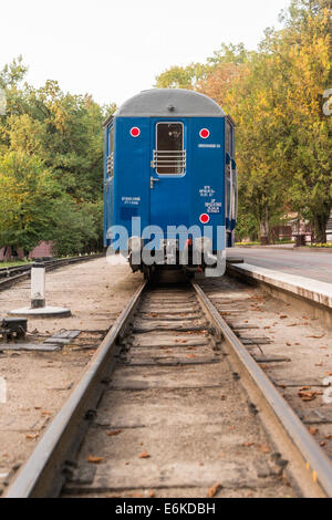 A blue train stopped in station waiting people Stock Photo