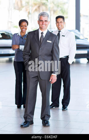 successful sales staff at a car dealership Stock Photo
