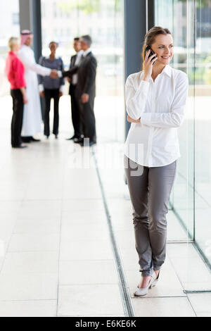 attractive businesswoman talking on cell phone Stock Photo