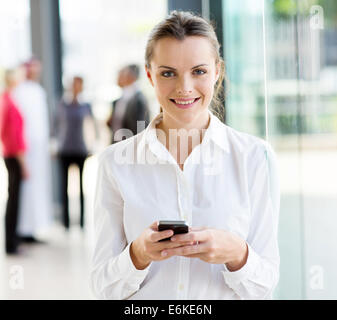 pretty young businesswoman using smart phone Stock Photo