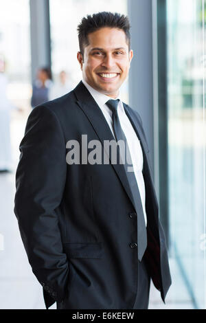 smart Indian businessman in black suit Stock Photo