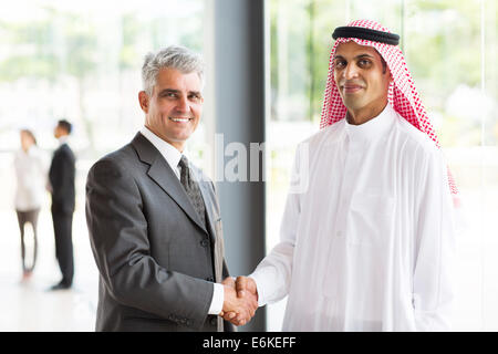 successful senior businessman handshake with Arabian partner Stock Photo