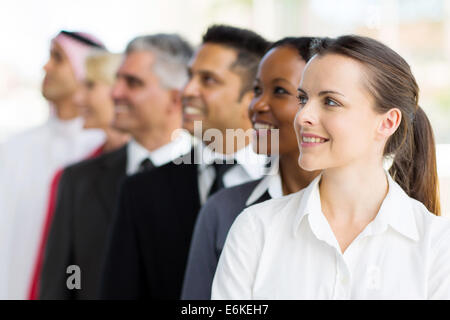 side view of group of businesspeople looking up Stock Photo