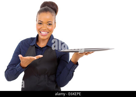 cheerful afro American waitress holding empty tray over white background Stock Photo
