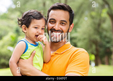 close up portrait of young Indian father and baby boy outdoors Stock Photo